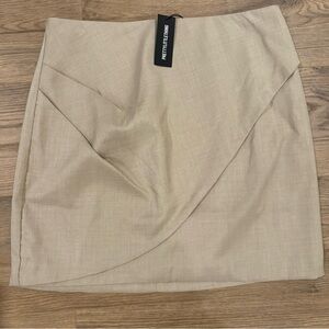 PrettyLittleThing Beige Asymmetric Wrap Mini Skirt